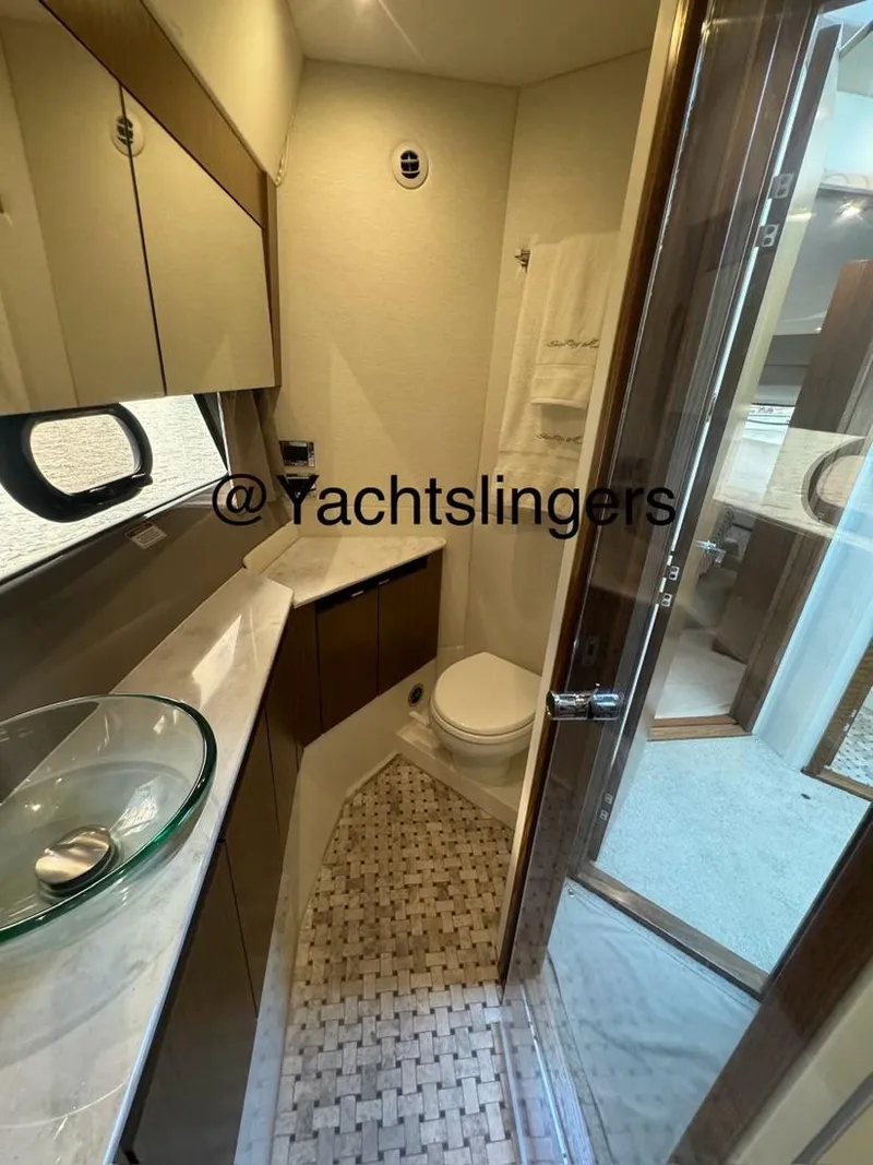 Slide: The Image of Luxurious bathroom in 2017 Sea Ray Sundancer yacht with modern fixtures and elegant design. - 22