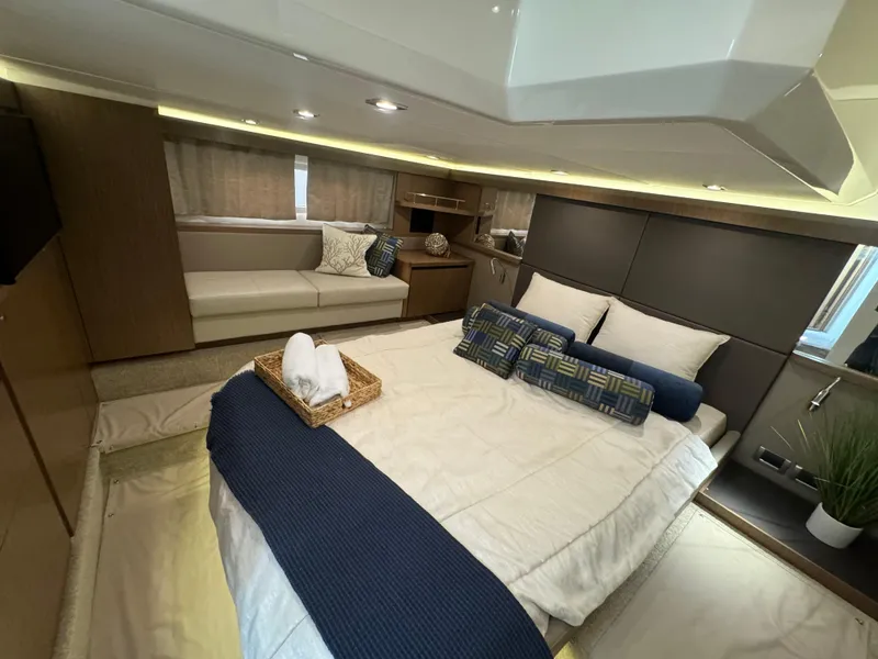 Slide: The Image of Luxurious 2017 Sea Ray Sundancer cabin interior with cozy bed and elegant decor. - 27