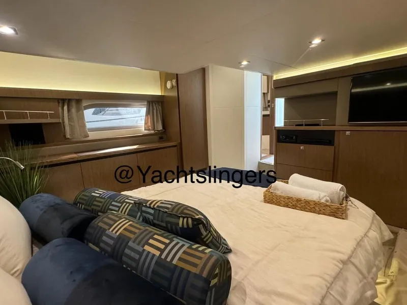 Slide: The Image of Luxurious 2017 Sea Ray Sundancer yacht interior with cozy bedroom and modern amenities. - 38