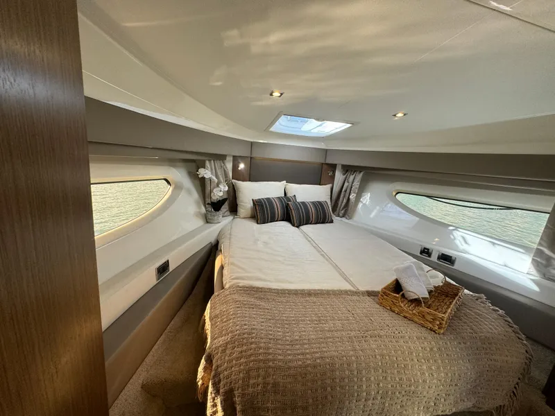 Slide: The Image of Luxurious 2017 Sea Ray Sundancer cabin with cozy bed and elegant decor. - 4