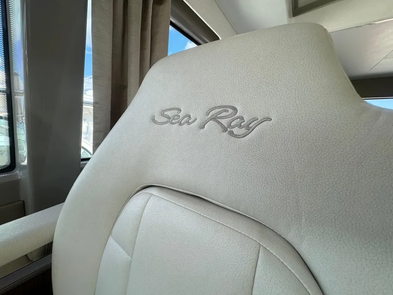 Slide: The Image of 2017 Sea Ray Sundancer interior seat with embroidered logo. - 49