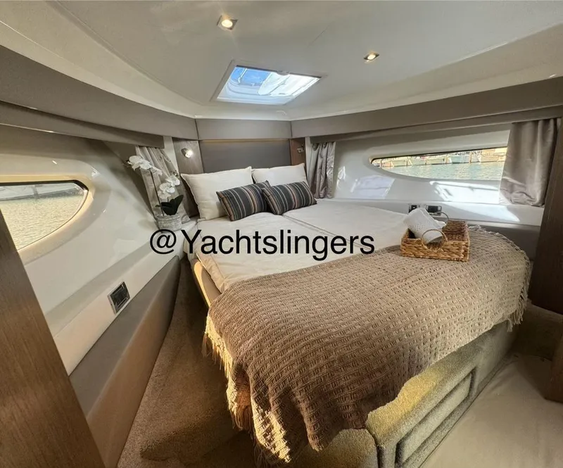 Slide: The Image of Luxurious 2017 Sea Ray Sundancer yacht cabin with cozy bed and elegant decor. - 6