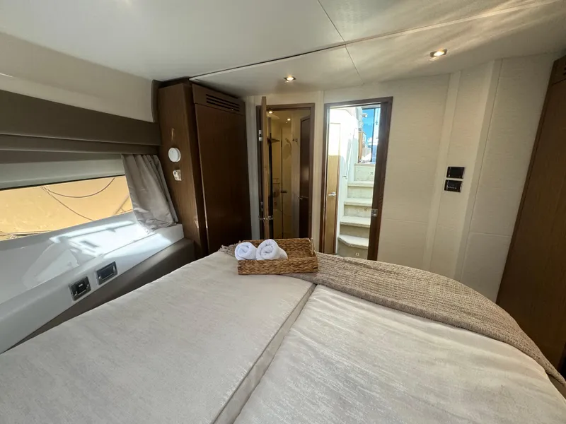 Slide: The Image of Luxurious 2017 Sea Ray Sundancer cabin interior with cozy bed and elegant decor. - 7