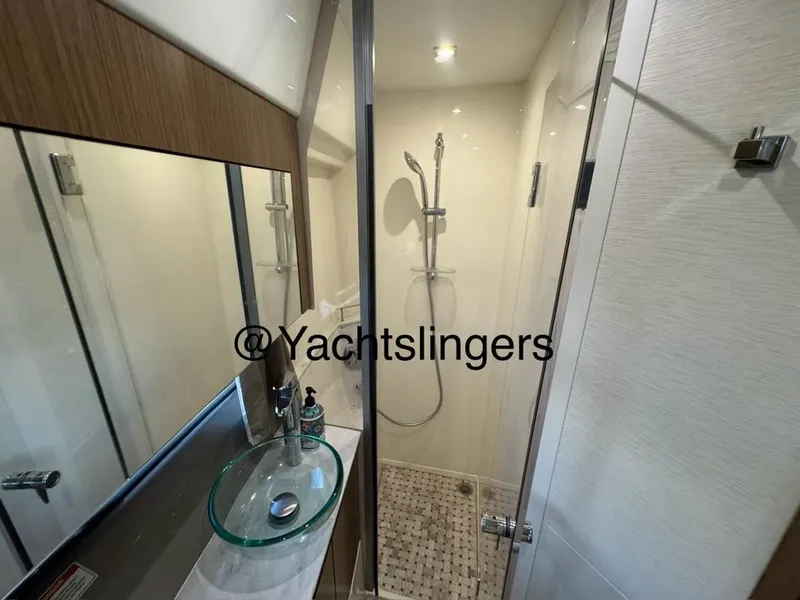 Slide: The Image of Modern bathroom in 2017 Sea Ray Sundancer yacht with glass sink and shower. - 9