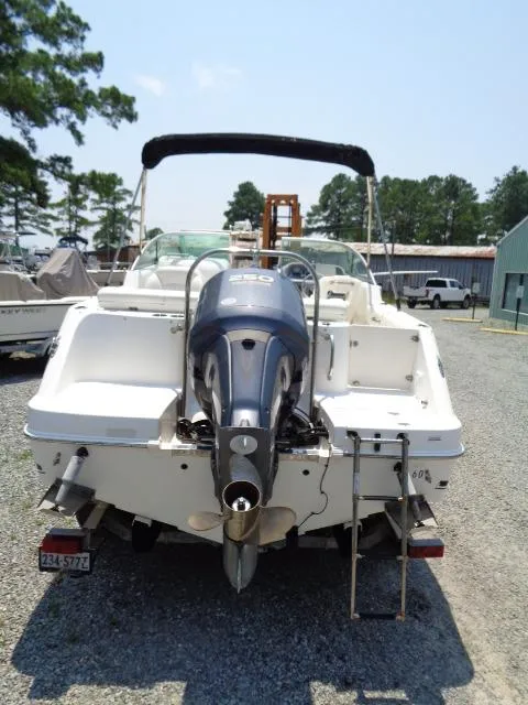 Slide: The Image of 2009 Robalo R227 Dual Console boat with outboard motor, rear view. - 11