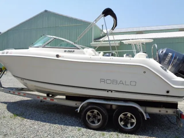 Slide: The Image of 2009 Robalo R227 Dual Console boat on a trailer. - 12