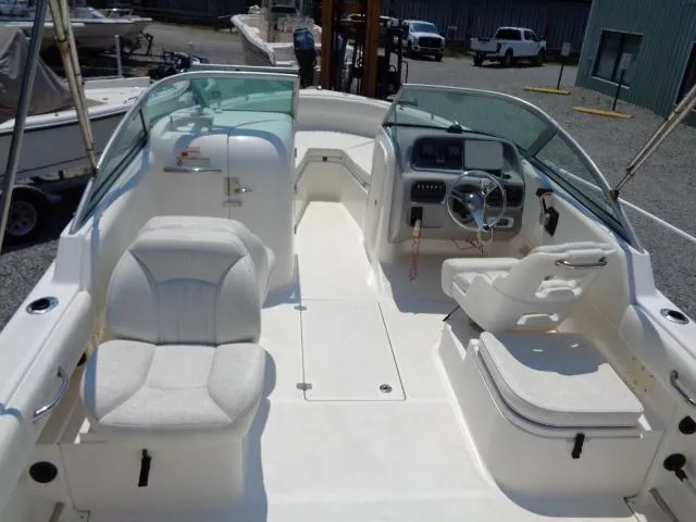 Slide: The Image of 2009 Robalo R227 Dual Console boat interior with seating and steering console. - 15