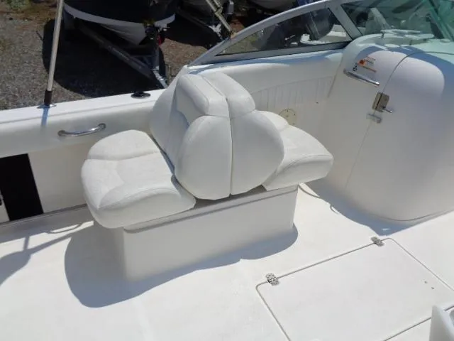 Slide: The Image of 2009 Robalo R227 Dual Console boat with white cushioned seating. - 21