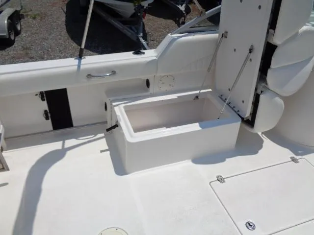 Slide: The Image of 2009 Robalo R227 Dual Console boat interior with storage compartment. - 22