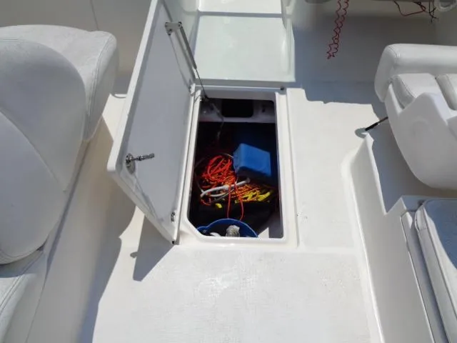 Slide: The Image of 2009 Robalo R227 Dual Console storage compartment with ropes and equipment. - 24
