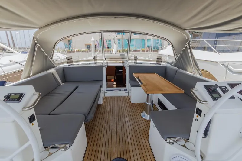 Slide: The Image of Interior of 2022 Bavaria C50 yacht with spacious seating and wooden table. - 13
