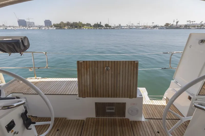 Slide: The Image of Bavaria C50 yacht deck overlooking calm waters, 2022 model. - 27