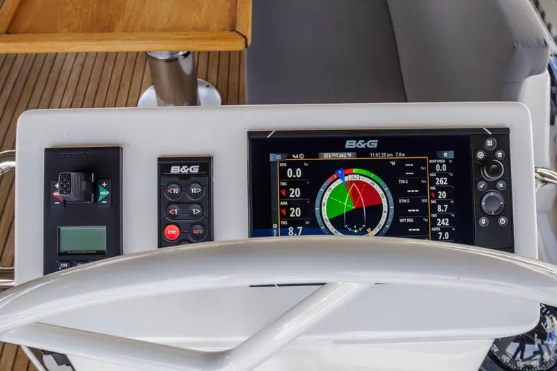 Slide: The Image of Bavaria C50 2022 yacht helm with B&G navigation display and controls. - 32