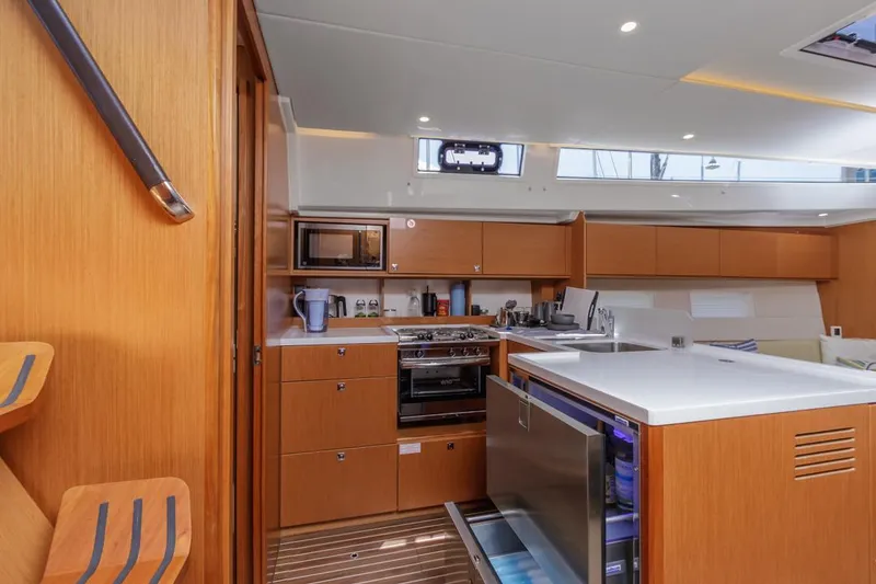 Slide: The Image of Modern kitchen interior of 2022 Bavaria C50 yacht with wooden cabinetry and appliances. - 35