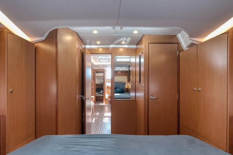 Slide: The Image of Interior of 2022 Bavaria C50 yacht, featuring wooden cabinetry and modern design. - 39