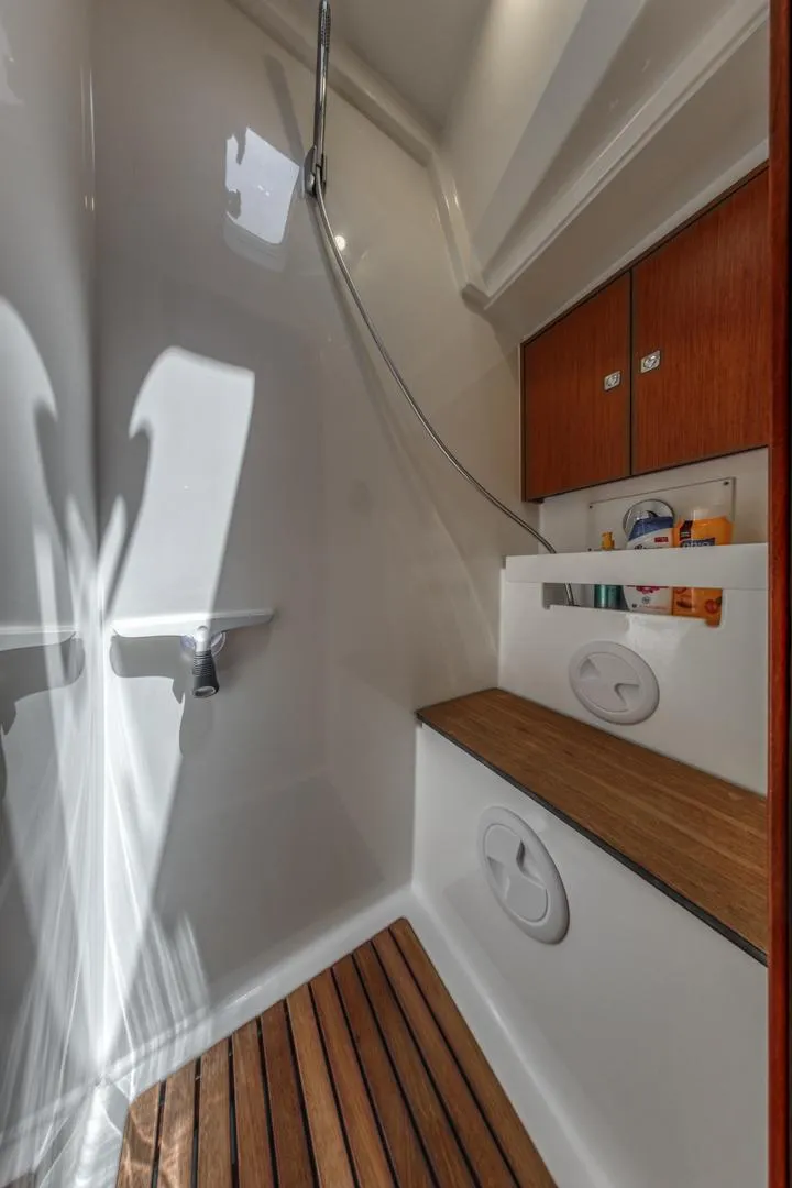 Slide: The Image of 2022 Bavaria C50 yacht bathroom with wooden accents and modern fixtures. - 40