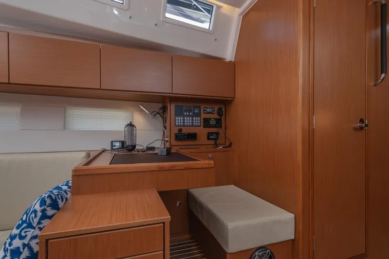 Slide: The Image of Interior of 2022 Bavaria C50 yacht with navigation station and wooden cabinetry. - 46