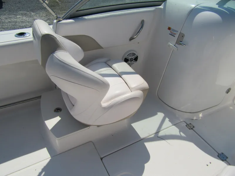 Slide: The Image of 2019 Robalo R207 Dual Console boat interior with white seating and console. - 8