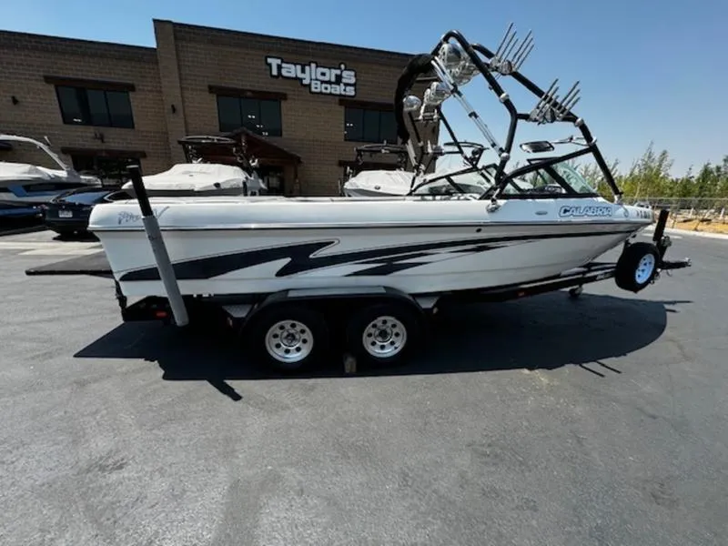 Slide: The Image of 2004 Calabria PRO-V boat parked at Taylor's Boats dealership. - 4