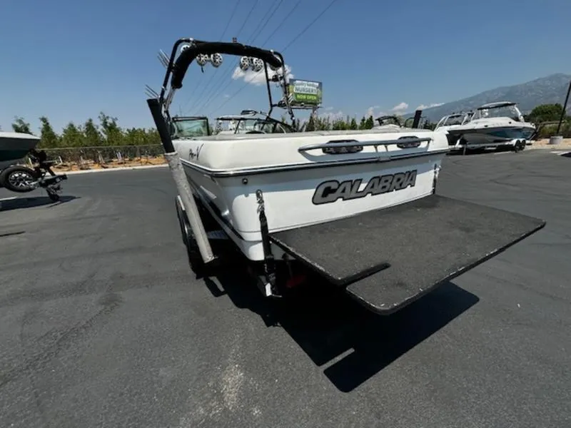 Slide: The Image of 2004 Calabria PRO-V boat with swim platform in a parking lot. - 6