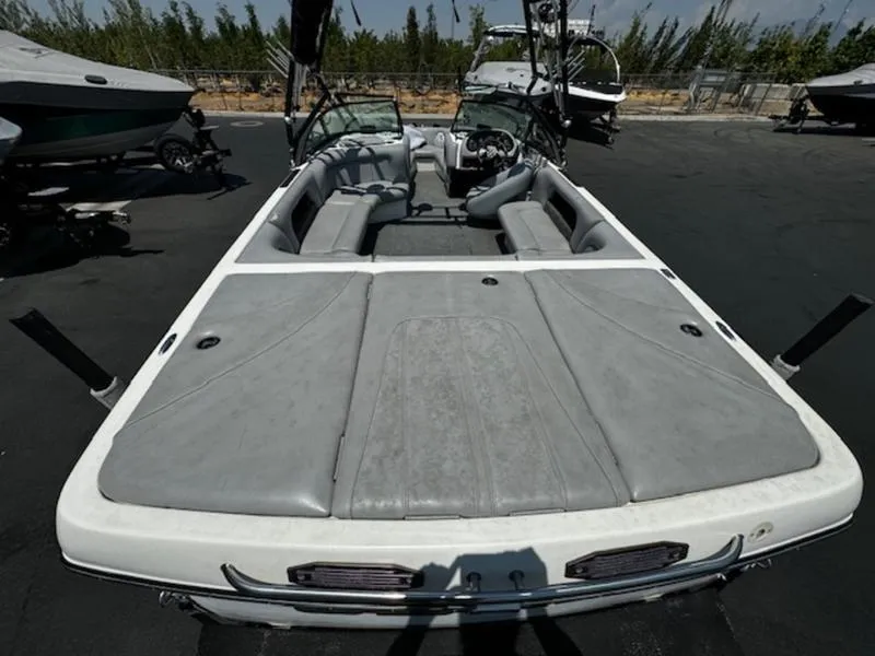 Slide: The Image of 2004 Calabria PRO-V boat with gray interior, parked outdoors. - 7