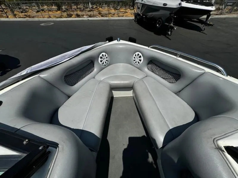 Slide: The Image of 2004 Calabria PRO-V boat interior with gray seating and speakers. - 8