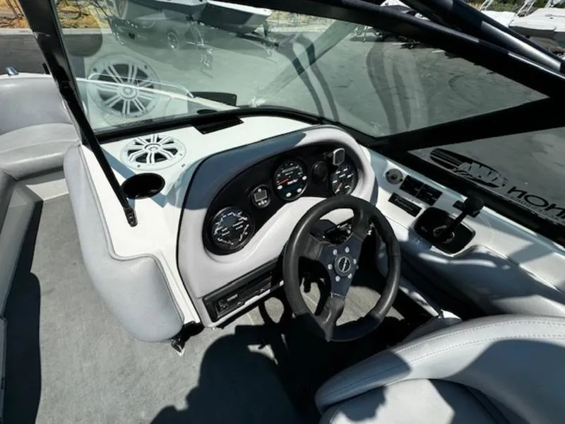 Slide: The Image of 2004 Calabria PRO-V boat dashboard with steering wheel and gauges. - 9