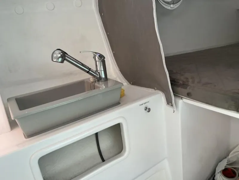 Slide: The Image of Interior of Corsair 880 Standard 2024 with sink and sleeping area. - 13