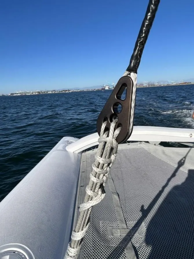 Slide: The Image of Corsair 880 Standard 2024 on open sea, close-up of rigging. - 20