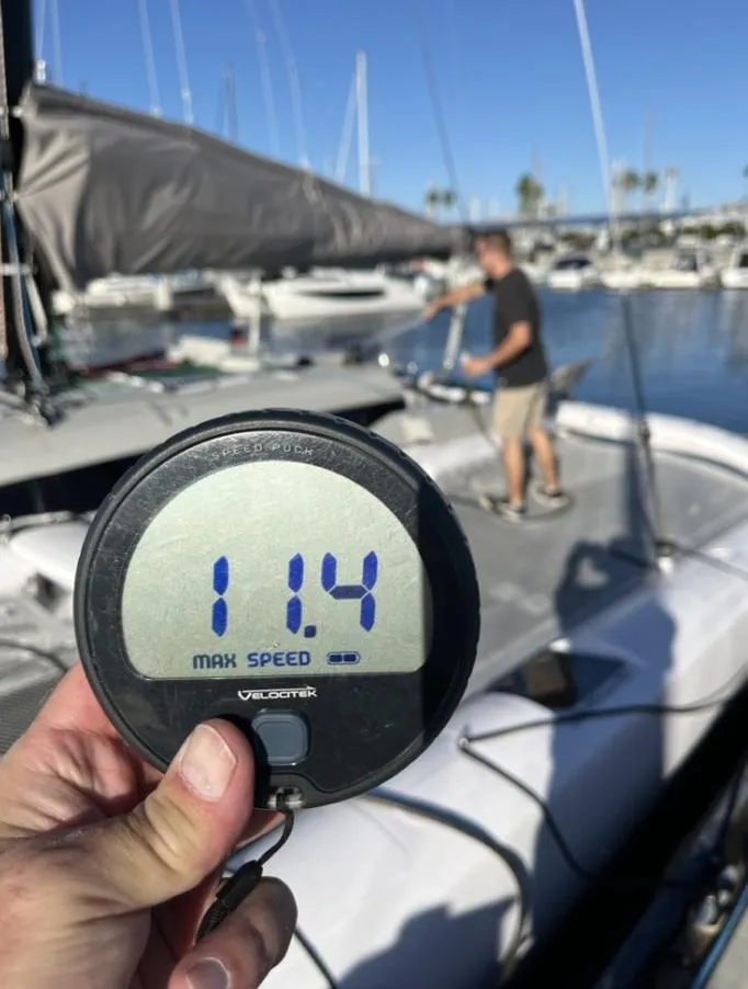 Slide: The Image of Corsair 880 Standard 2024, speedometer showing 11.4 knots in harbor. - 6