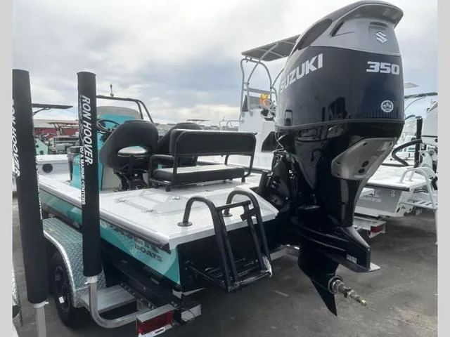 Slide: The Image of 2024 Majek Boats 24 REAPER with Suzuki 350 engine, displayed on a trailer. - 10