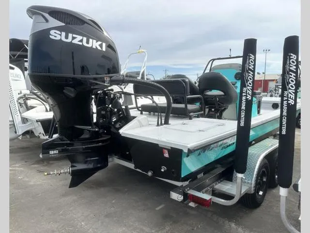 Slide: The Image of 2024 Majek Boats 24 REAPER with Suzuki engine on trailer. - 11