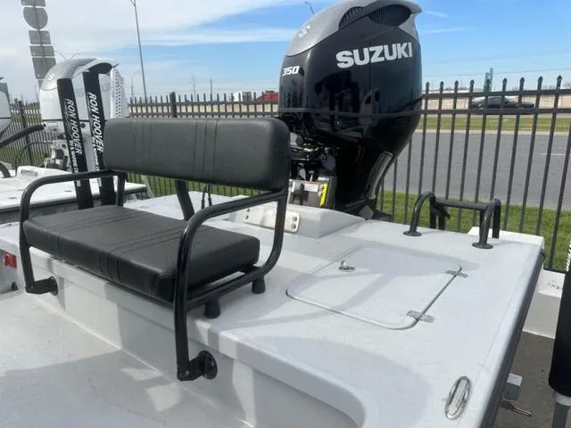 Slide: The Image of 2024 Majek Boats 24 REAPER with Suzuki engine, featuring a black bench seat. - 9