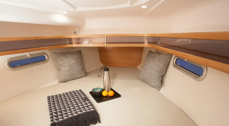 Slide: The Image of Cozy cabin interior of 2026 Dragonfly 32 sailboat with cushions and a tray. - 4