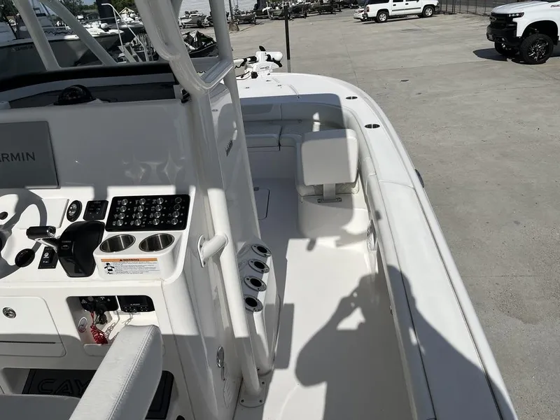 Slide: The Image of 2021 Caymas 26 HB boat interior with control panel and seating area. - 14
