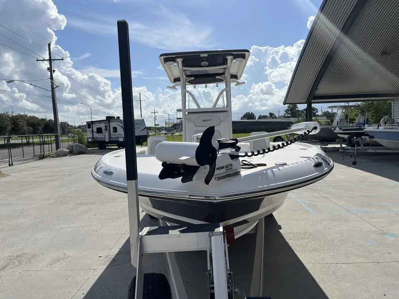 Slide: The Image of 2021 Caymas 26 HB boat on trailer, featuring Minn Kota trolling motor. - 4