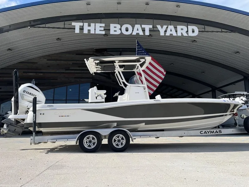 Slide: The Image of 2021 Caymas 26 HB boat on trailer at The Boat Yard, featuring Yamaha engine. - 5