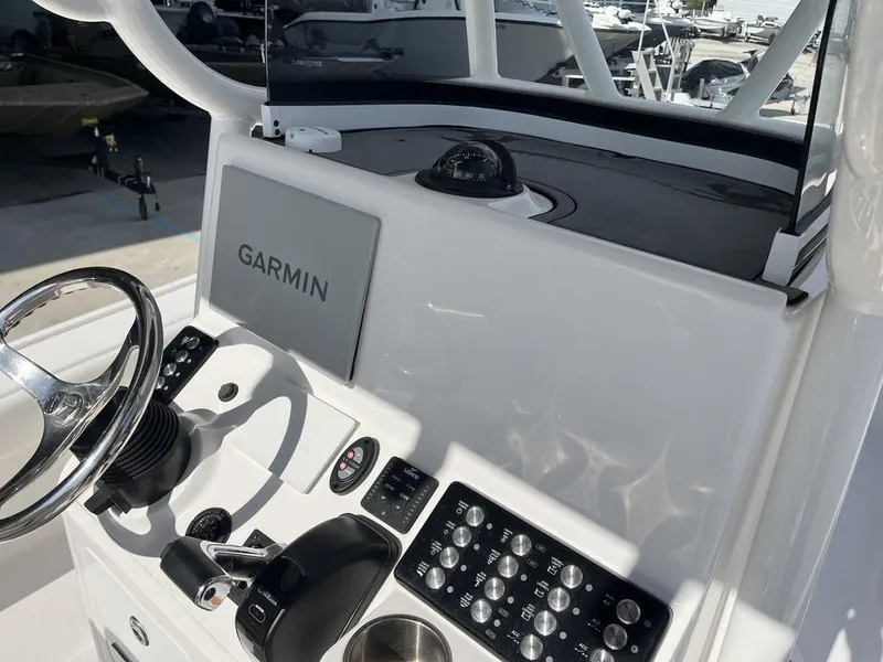 Slide: The Image of 2021 Caymas 26 HB boat dashboard with Garmin navigation system. - 9