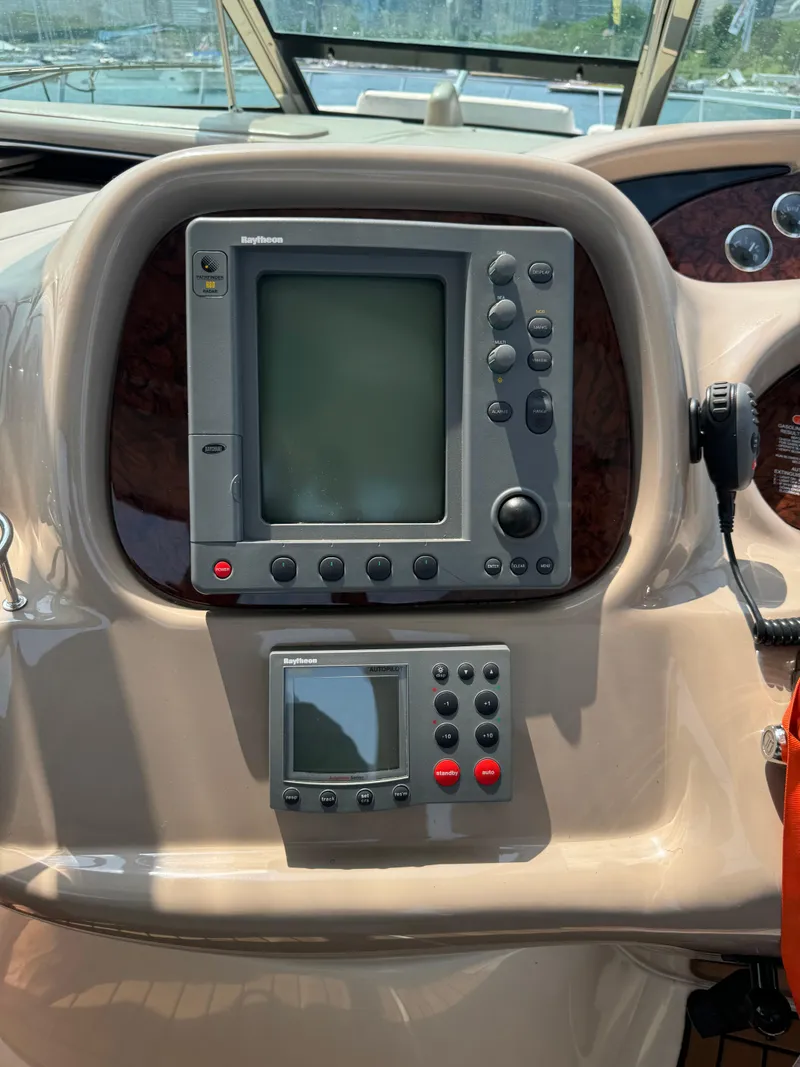 Slide: The Image of Control panel of 2001 Sea Ray 380 Sundancer boat with navigation equipment. - 27