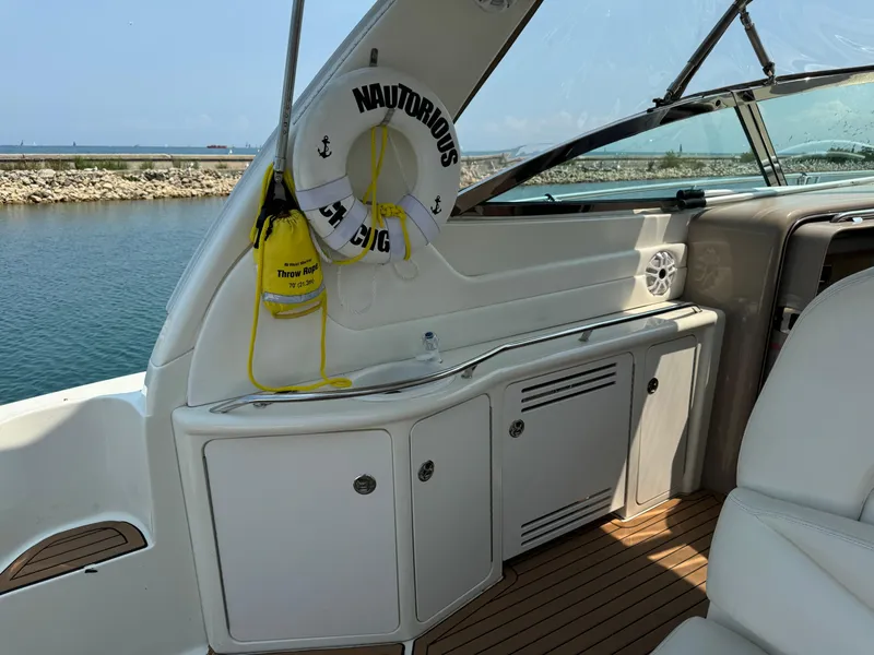 Slide: The Image of Interior of 2001 Sea Ray 380 Sundancer yacht with life preserver and throw rope. - 7