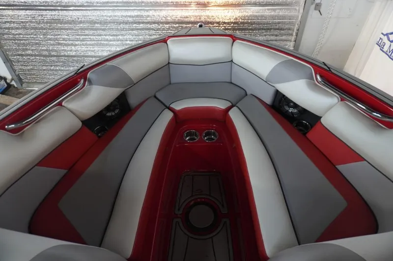 Slide: The Image of 2019 Moomba Craz MG boat interior with red and gray seating, cup holders, and sleek design. - 18