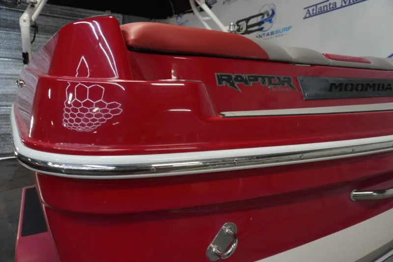 Slide: The Image of Red 2019 Moomba Craz boat with Raptor branding, featuring sleek design and honeycomb decal. - 7