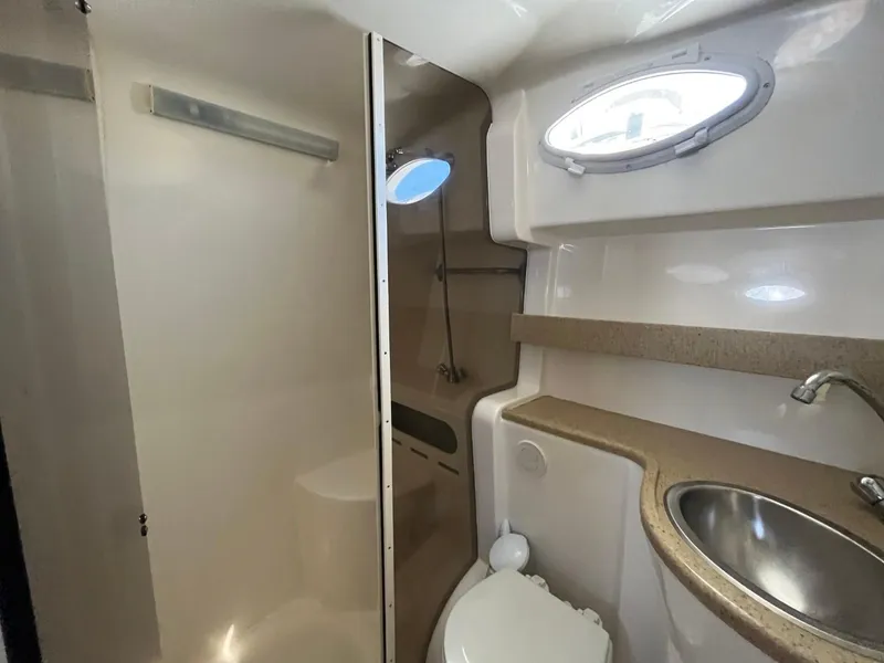 Slide: The Image of 2006 Rinker Fiesta Vee 342 bathroom with sink, toilet, and shower. - 23