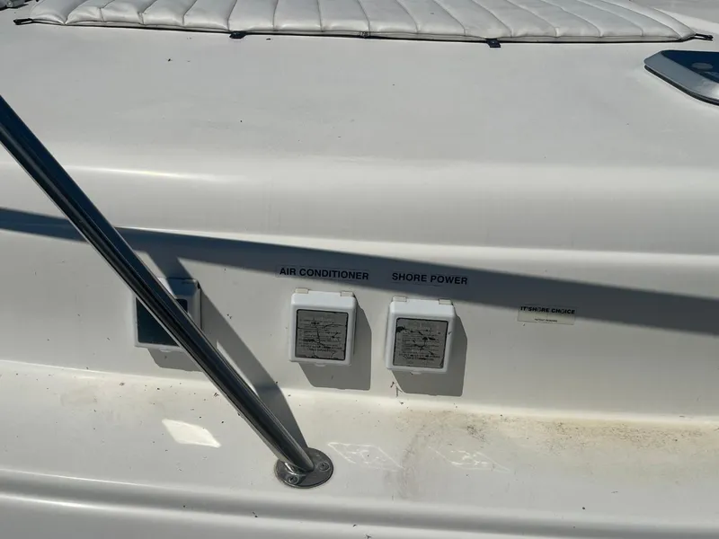 Slide: The Image of 2006 Rinker Fiesta Vee 342 boat with air conditioner and shore power outlets. - 3