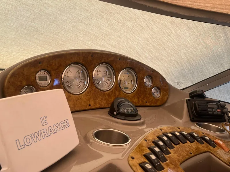 Slide: The Image of 2006 Rinker Fiesta Vee 342 dashboard with Lowrance navigation system and control panel. - 5