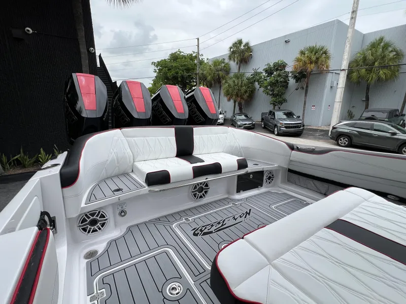 Slide: The Image of 2025 Nor-Tech 400 Supersport boat interior with sleek seating and powerful engines. - 11