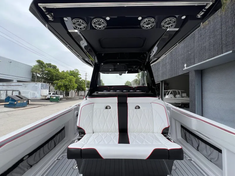 Slide: The Image of 2025 Nor-Tech 400 Supersport boat interior with sleek seating and modern design. - 12