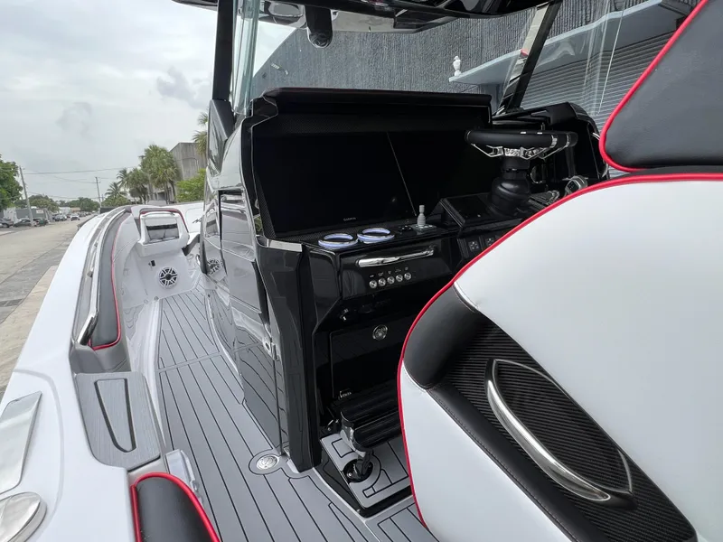 Slide: The Image of 2025 Nor-Tech 400 Supersport boat interior with sleek design and modern controls. - 18