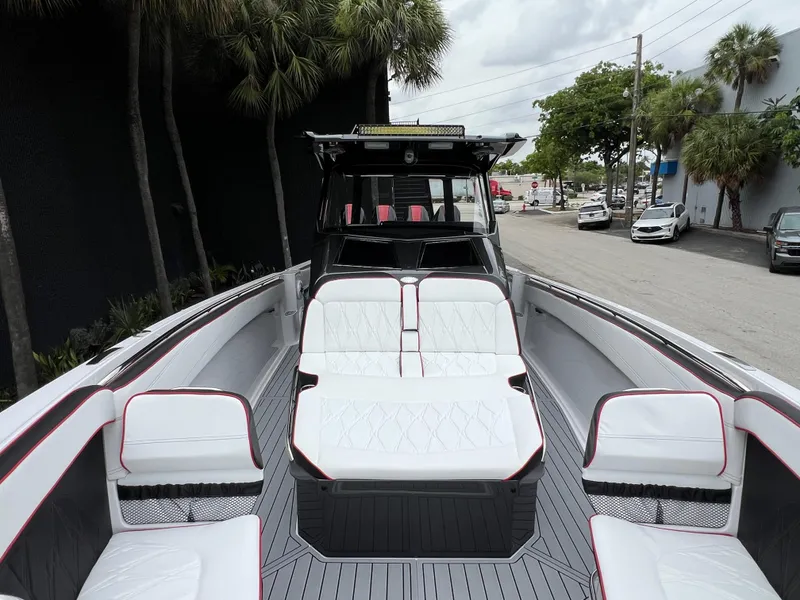 Slide: The Image of 2025 Nor-Tech 400 Supersport boat with luxurious seating and sleek design. - 22