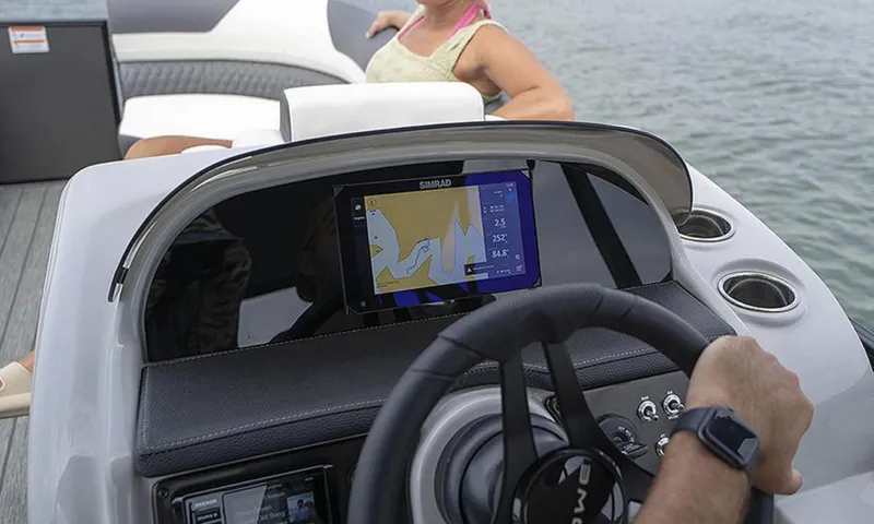 Slide: The Image of 2025 Lowe RS 250 WT boat dashboard with navigation display on water. - 2